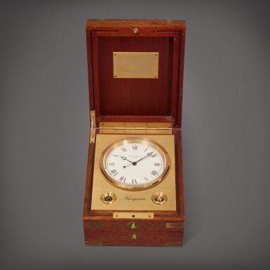 View full screen - View 1 of Lot 65. Reference 1215 Naviquartz | A gilt brass table clock with wooden box, Circa 1980.