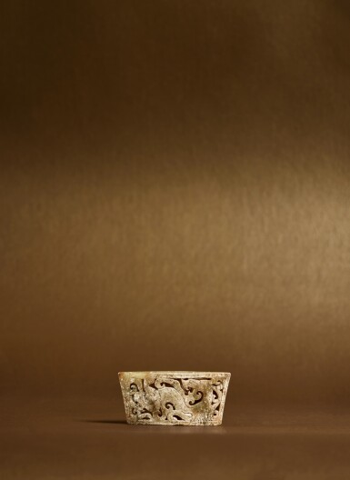 View full screen - View 1 of Lot 115. A rare reticulated jade 'chilong' sword chape, Eastern Zhou dynasty, Warring States period .