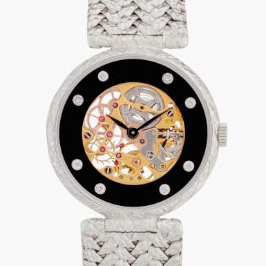 View full screen - View 1 of Lot 521. An 18k white gold semi-skeletonized wristwatch, Circa 1980.