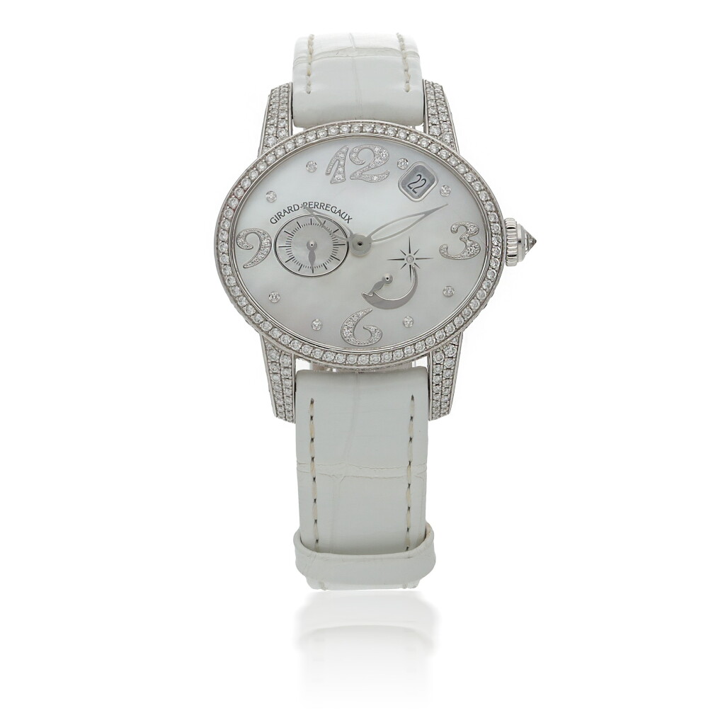 View full screen - View 1 of Lot 156. GIRARD-PERREGAUX | CAT'S EYE, REF 80482 WHITE GOLD AND DIAMOND-SET OVAL WRISTWATCH WITH DATE AND POWER RESERVE INDICATION CIRCA 2002.