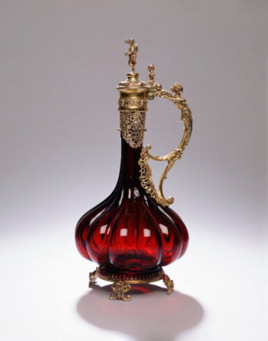 View full screen - View 1 of Lot 334. A Large Silver-Gilt Mounted Ruby Glass Claret Jug, Probably Austria, Circa 1870-80.
