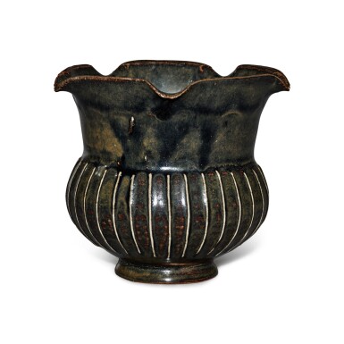View full screen - View 1 of Lot 199. A black-glazed ribbed vase, Northern Song / Jin dynasty | 北宋 / 金 黑釉棱線紋花口罐.
