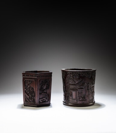 View full screen - View 1 of Lot 178. A hexagonal zitan 'bamboo and flowers' brushpot and a carved hardwood 'boys' brushpot, Qing dynasty, 19th and 20th century | 清十九世紀 紫檀雕四君子圖筆筒 及 二十世紀 硬木雕戲嬰圖筆筒.