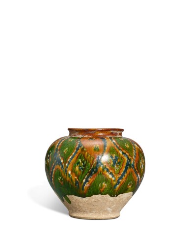 View full screen - View 1 of Lot 701. A rare sancai-glazed pottery jar, Tang dynasty | 唐 三彩菱花紋罐.