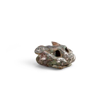 View full screen - View 1 of Lot 3612. A silver-inlaid bronze 'tiger' fitting, Eastern Zhou dynasty, Warring States period | 東周戰國 銅錯銀虎首飾件.