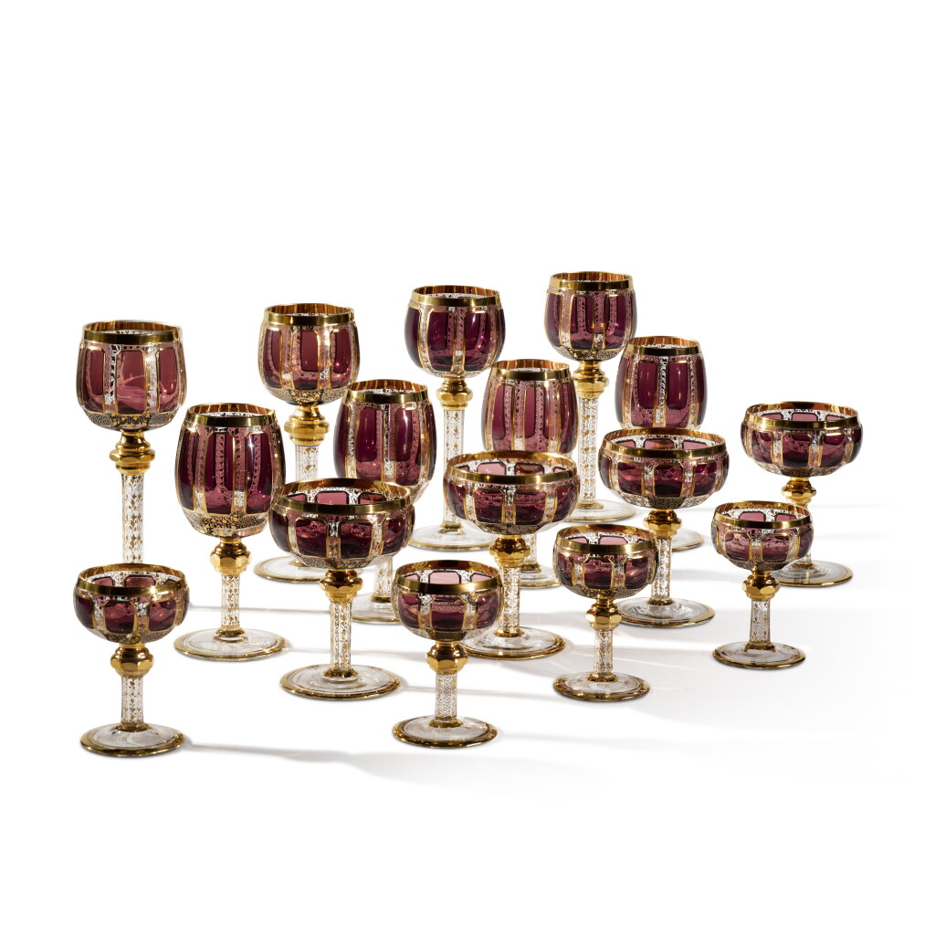 View full screen - View 1 of Lot 75. A Bohemian Amethyst-Tinted and Gilt-Glass Table Service, Late 19th/Early 20th century.
