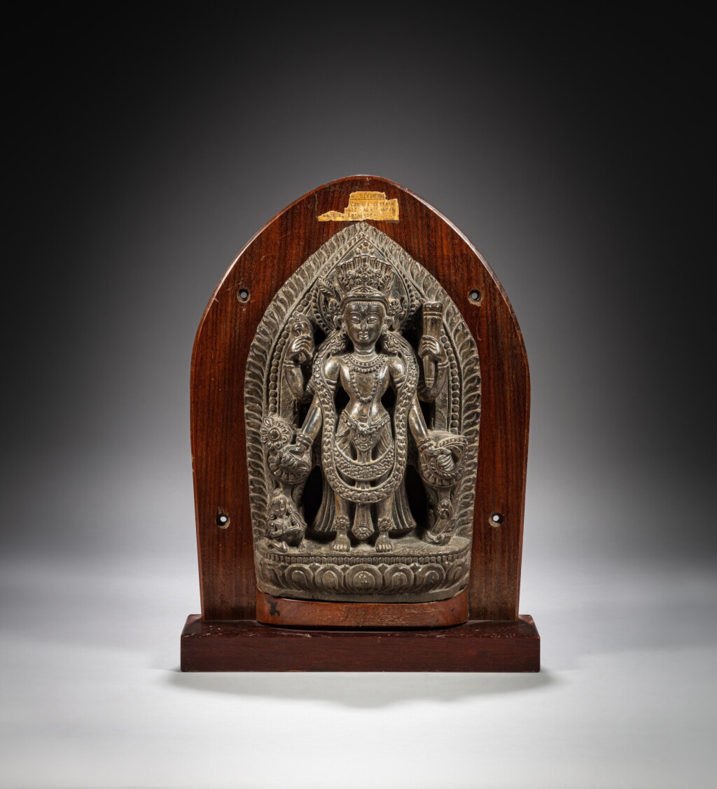 View full screen - View 1 of Lot 166. A stone figure of Vishnu, Nepal, 18th century | 尼泊爾 十八世紀 石雕毗濕奴立像.