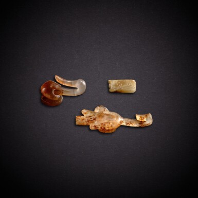 View full screen - View 1 of Lot 7876. Three jade and hardstone ornaments, Western Zhou - Han dynasty | 西周至漢 玉飾、瑪瑙帶鉤及水晶帶鉤.