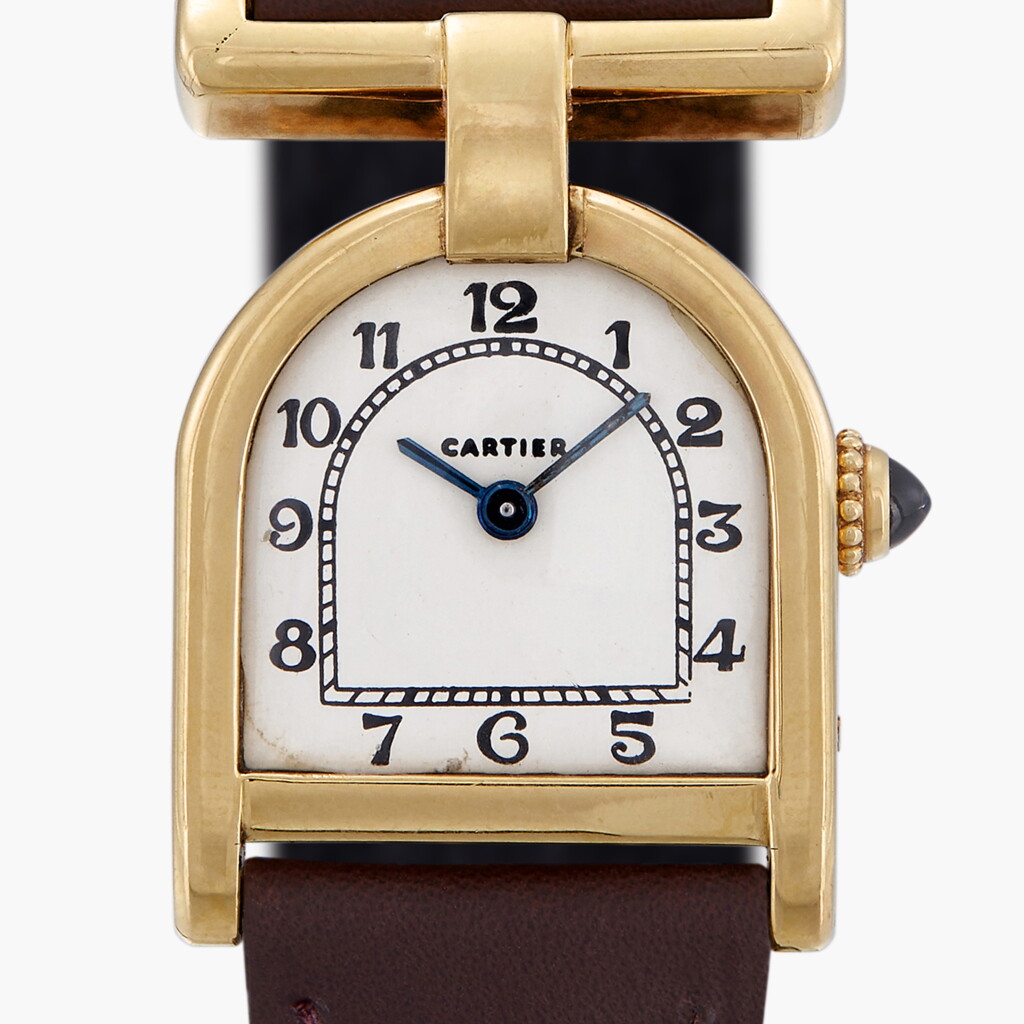 View full screen - View 1 of Lot 120. Stirrup | A yellow gold stirrup-form wristwatch with a gold deployant buckle | Made in 1976-77.