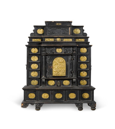 View full screen - View 1 of Lot 3. A South German gilt-metal mounted, ebonised and carved table cabinet, possibly Augsburg, early 17th century.