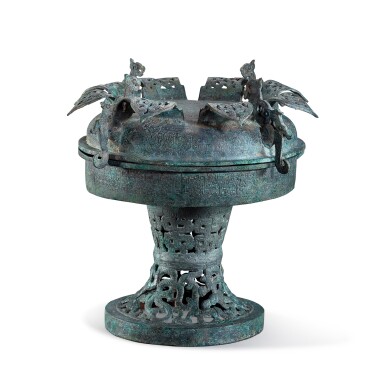 View full screen - View 1 of Lot 1070. An archaic bronze ritual food vessel and cover, Dou, Warring States period | 戰國 青銅鏤空龍紋蓋豆.