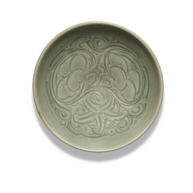 View full screen - View 1 of Lot 331. A carved 'Yaozhou' celadon-glazed 'floral' bowl, Jin dynasty | 金 耀州窰青釉刻花卉紋盌.