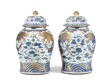 View full screen - View 1 of Lot 18. A rare pair of gilt-decorated blue and white and famille rose 'dragon' vases and covers Qing dynasty, 18th-19th century | 清十八至十九世紀 描金青花粉彩雙龍戲珠紋將軍瓶一對.