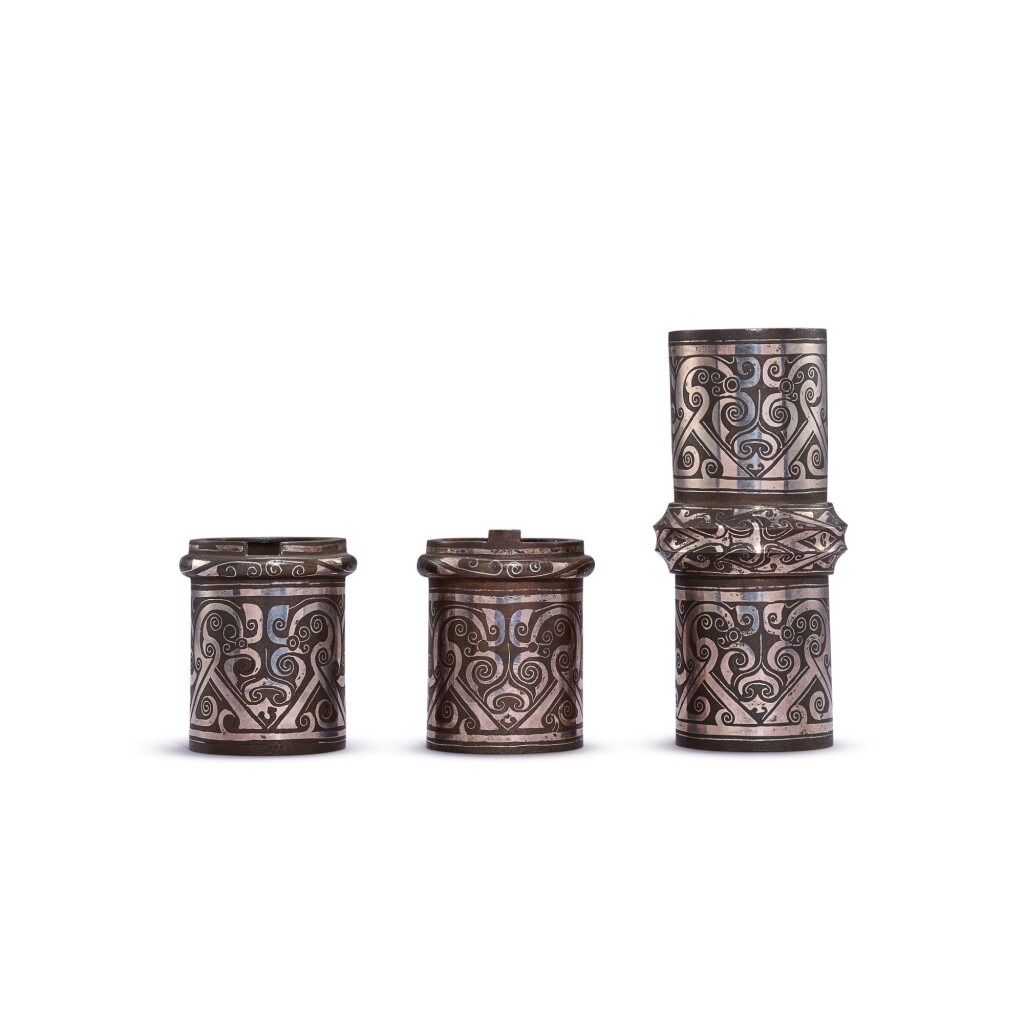 View full screen - View 1 of Lot 9401. A set of silver-inlaid bronze chariot canopy shaft fittings, Western Han dynasty | 西漢 銅錯銀幾何卷雲紋傘鋌.