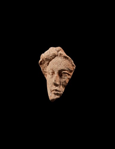 View full screen - View 1 of Lot 114. A Fragmentary Terracotta Head of a Woman or Goddess, circa 4th/1st Century B.C..