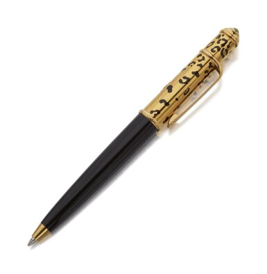 View full screen - View 1 of Lot 11. CARTIER | A GOLD PLATED AND BLACK LACQUER BALLPOINT PEN, CIRCA 2007.