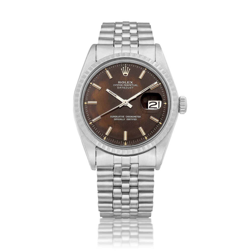 View full screen - View 1 of Lot 8214. DateJust, Reference 1603 | A stainless steel wristwatch with tropical dial, date and bracelet, Circa 1970 | 勞力士 | DateJust 型號1603 | 精鋼鏈帶腕錶,備棕式錶盤及日期顯示,約1970年製.