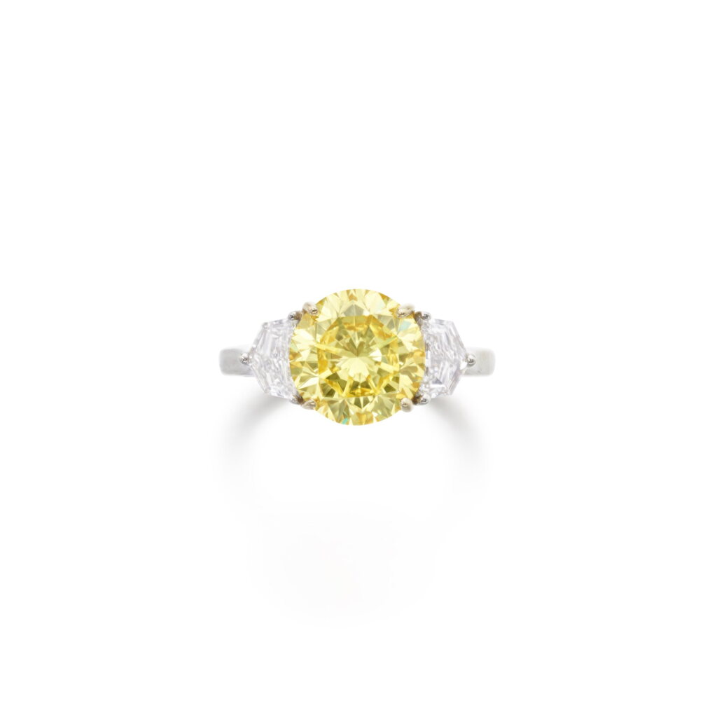 View full screen - View 1 of Lot 521. Fancy Intense Yellow diamond ring.