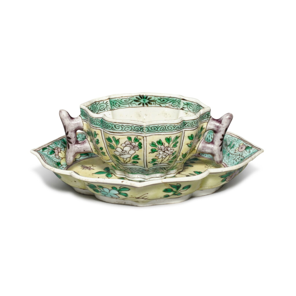 View full screen - View 1 of Lot 655. A famille-verte biscuit 'floral' quatrefoil cup and saucer, Qing dynasty, Kangxi period | 清康熙 素三彩花卉紋海棠式盃碟一套.