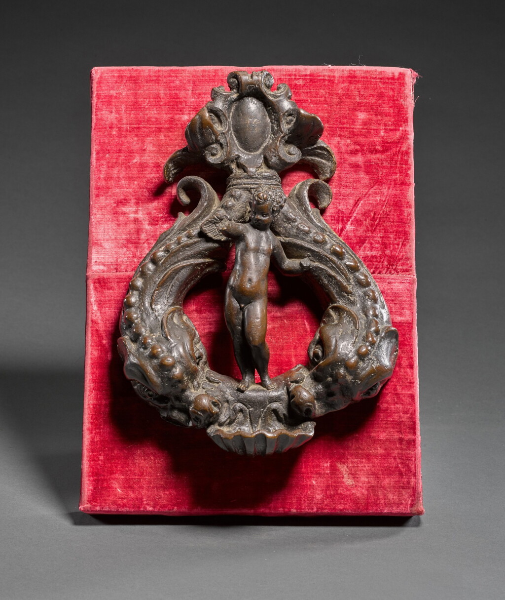 View full screen - View 1 of Lot 30. Doorknocker with a putto and dolphins.