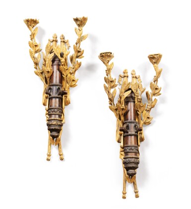 View full screen - View 1 of Lot 9. A pair of Louis XVI style patinated and gilt-bronze wall appliques, 19th century.