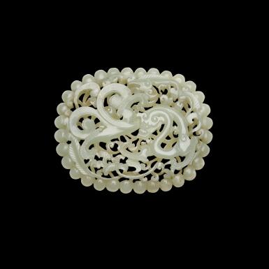 View full screen - View 1 of Lot 188. A reticulated celadon jade 'chilong' plaque, Ming dynasty | 明 青白玉鏤雕穿花螭龍紋帶板.