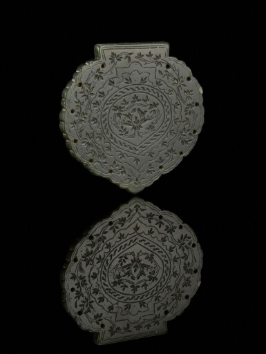View full screen - View 1 of Lot 101. A Timurid carved jade pendant, signed by Nuri, Persia, 15th century.