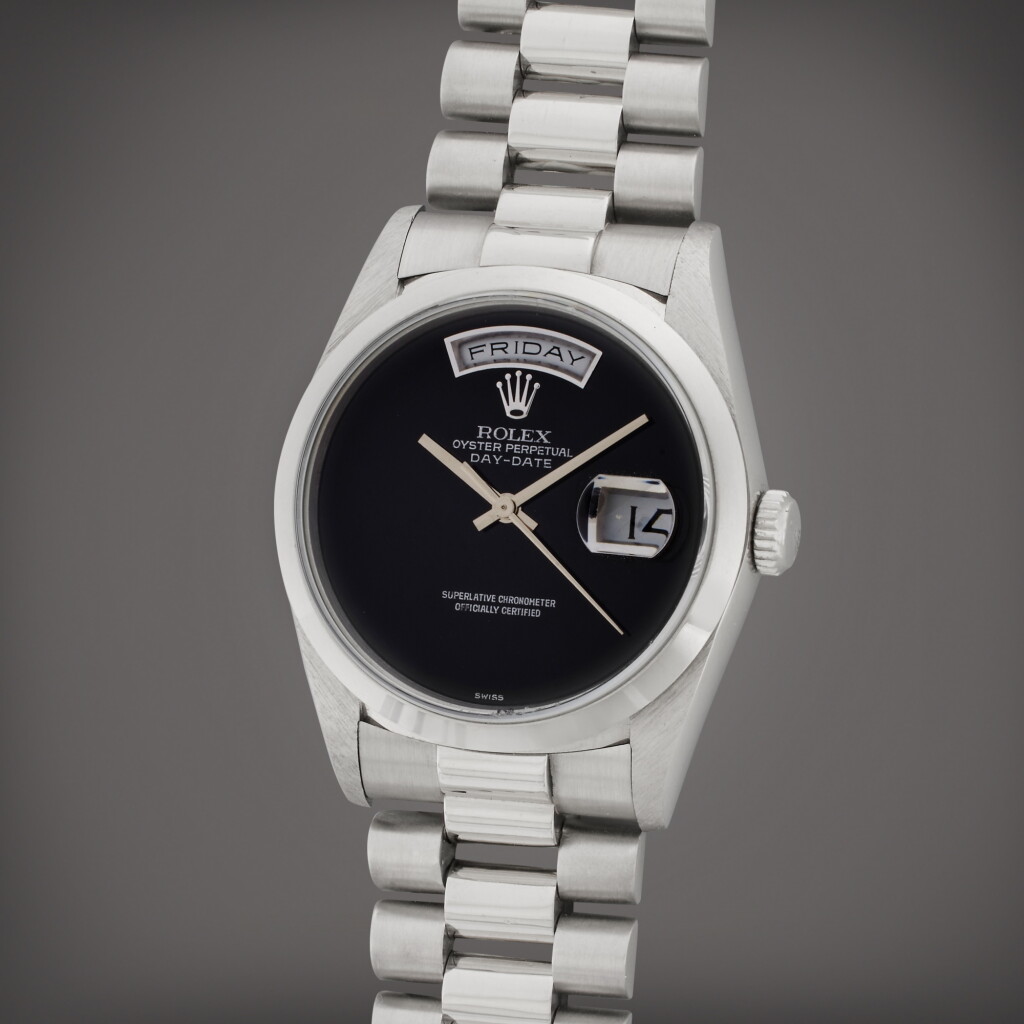 View full screen - View 1 of Lot 13. Reference 18206 Day-Date | A platinum automatic wristwatch with day, date, bracelet, and onyx dial, Circa 1989.