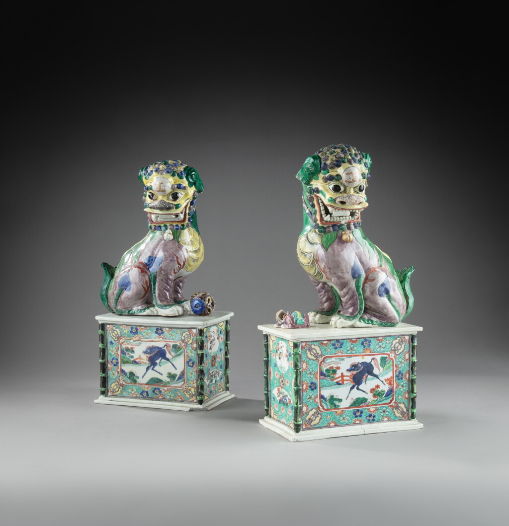 View full screen - View 1 of Lot 64. A pair of famille-verte biscuit Buddhist lions, 19th - 20th century | 十九至二十世紀 五彩佛獅擺件一對.