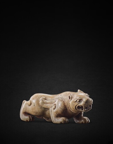 View full screen - View 1 of Lot 941. A very rare celadon jade mythical beast, Late Western Han dynasty | 西漢晚期 玉神獸.