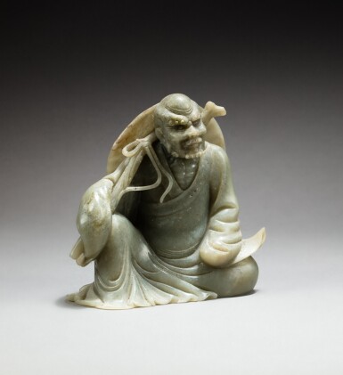 View full screen - View 1 of Lot 248. A carved celadon jade figure of a seated luohan, Republican period | 民國 青白玉雕羅漢坐像.