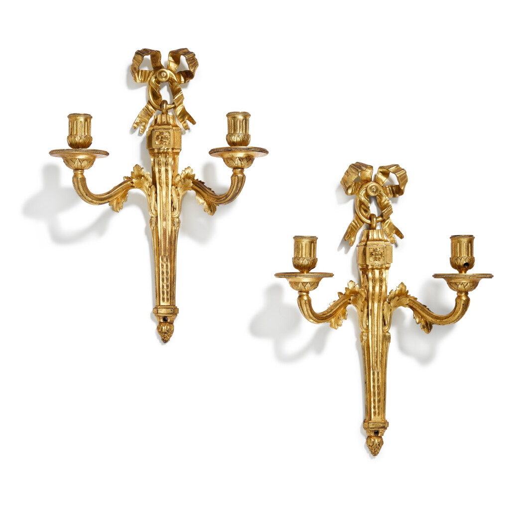 View full screen - View 1 of Lot 98. A pair of Louis XVI gilt bronze twin-light wall appliques, circa 1770.