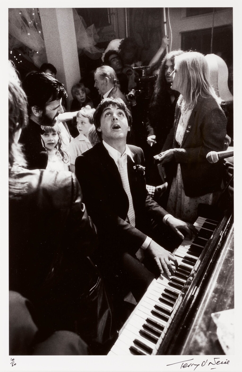 View full screen - View 1 of Lot 7. TERRY O'NEILL | PAUL MCCARTNEY AT RINGO STARR'S WEDDING, 1981.