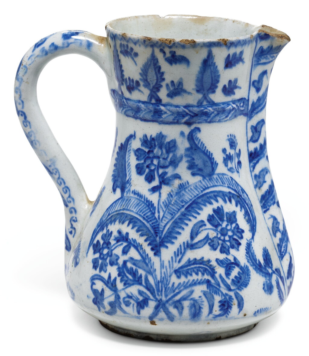 View full screen - View 1 of Lot 289. A BLUE AND WHITE KUTAHYA POTTERY JUG, TURKEY, FIRST HALF 18TH CENTURY.