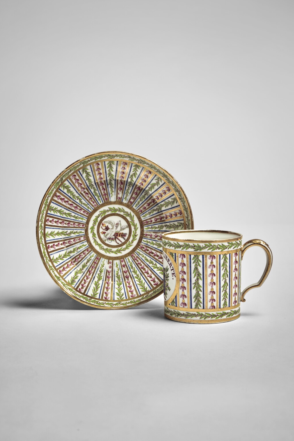 View full screen - View 1 of Lot 687. A Sèvres (Hard-Paste) Porcelain Revolutionary Inscribed Cup and Saucer (Gobelet litron et soucoupe), Late 18th Century.