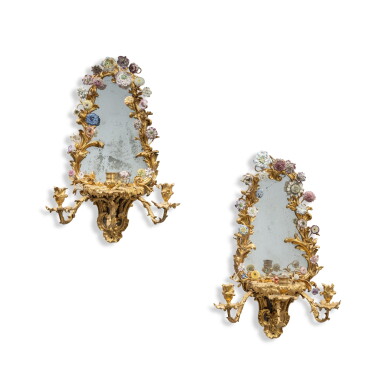 View full screen - View 1 of Lot 840. A pair of German gilt-bronze-mounted three-light girandoles, 19th century, with European porcelain flowers.