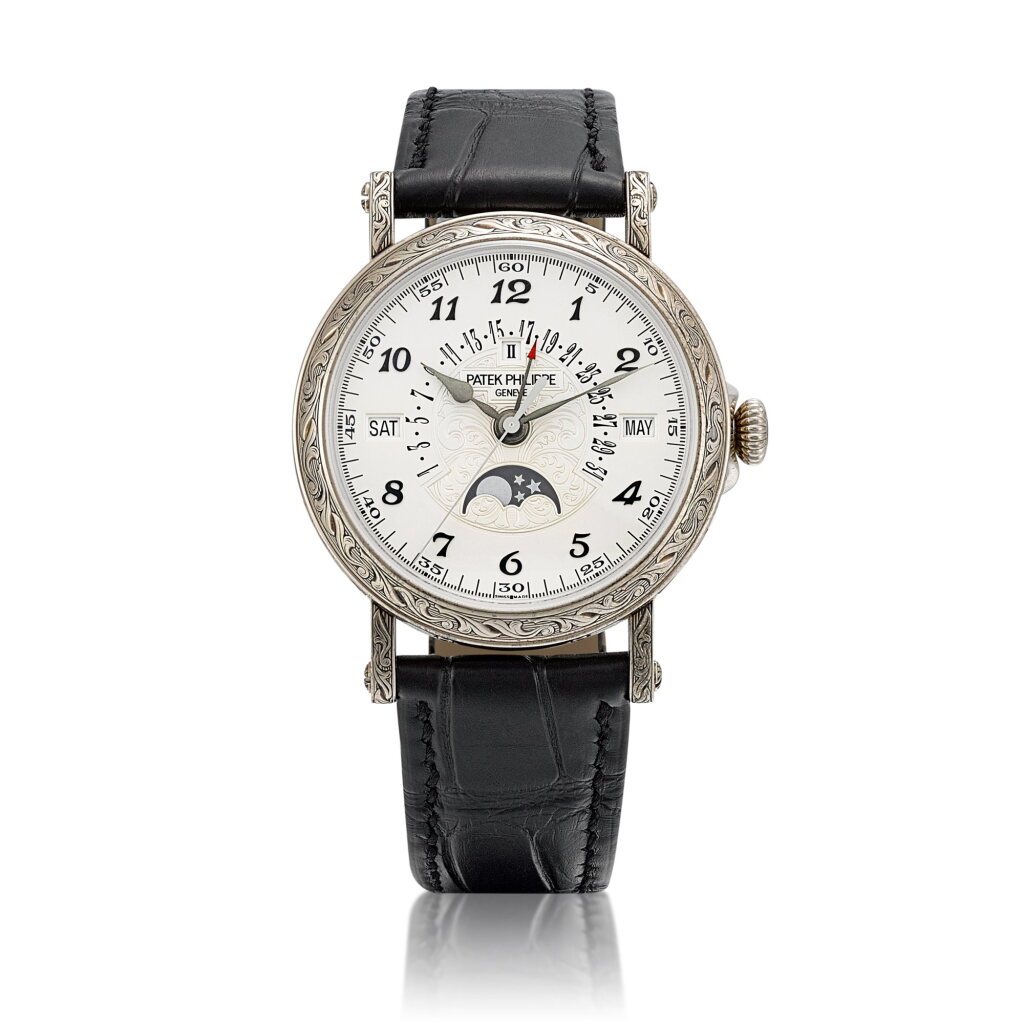 View full screen - View 1 of Lot 2301. Reference 5160 | A white gold perpetual calendar wristwatch with day, retrograde date, moon phases, leap year indication and hand-engraved case, Circa 2020 | 百達翡麗 | 型號5160 | 白金萬年曆腕錶,備逆跳日期、星期、月相、閏年顯示及手繪錶殼,約2020年製.