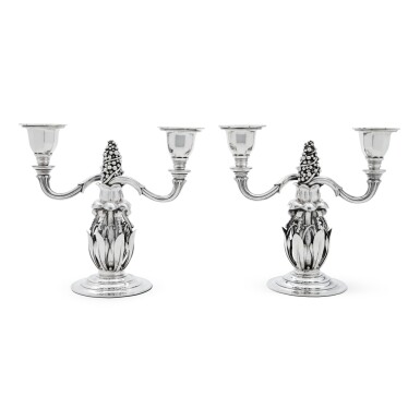 View full screen - View 1 of Lot 28. A pair of Danish silver two-light candelabra, No. 244, Georg Jensen Silversmithy, Copenhagen, 1918.