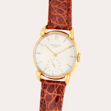 View full screen - View 1 of Lot 321. Reference 1590 | A yellow gold wristwatch with teardrop lugs | Made in 1949.