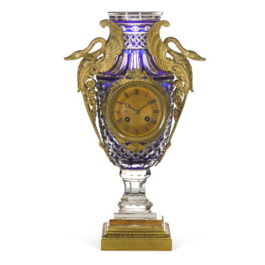 View full screen - View 1 of Lot 104. AN EMPIRE-STYLE GILT-BRONZE MOUNTED CRYSTAL VASE CLOCK IN THE MANNER OF BACCARAT, FRENCH, CIRCA 1900.