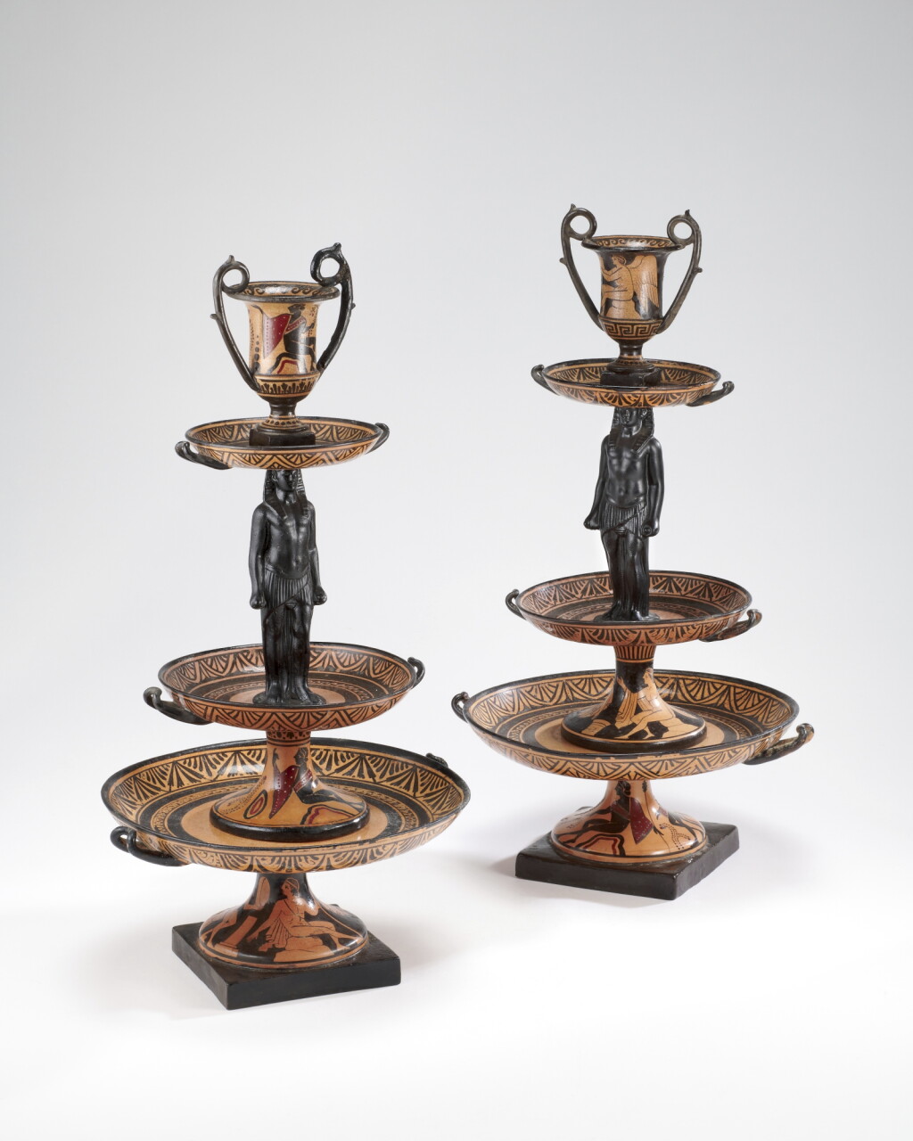 View full screen - View 1 of Lot 405. Two Naples Giustiniani terracotta three-tier table centrepieces, circa 1830.