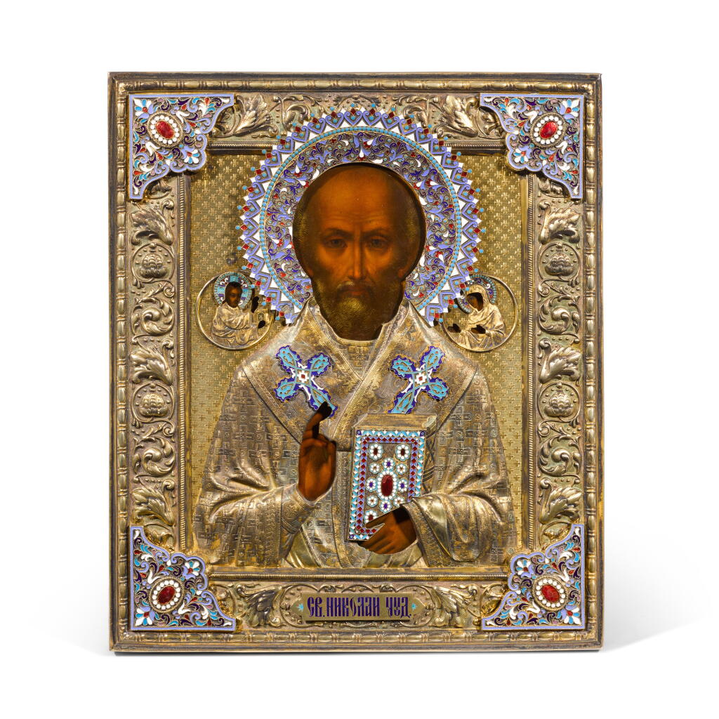 View full screen - View 1 of Lot 334. A silver-gilt, cloisonné and champlevé enamel icon of St Nicholas the Wonderworker, Ivan Alexeevich Alexeev, retailed by Nemirov-Kolodkin, Moscow, 1899-1908.