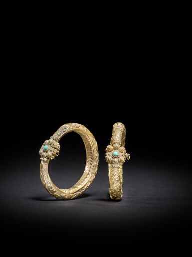 View full screen - View 1 of Lot 127. A pair of repoussé gold bracelets, Syria, 11th-12th century .