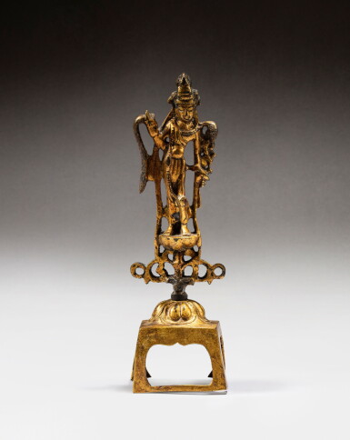 View full screen - View 1 of Lot 49. A gilt-bronze figure of Avalokiteshvara, probably Tang dynasty | 或唐 鎏金銅觀世音菩薩立像.