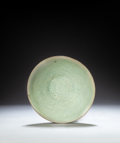 View full screen - View 1 of Lot 104. A carved Qingbai bowl, Song dynasty | 宋 青白釉刻花卉紋盌.