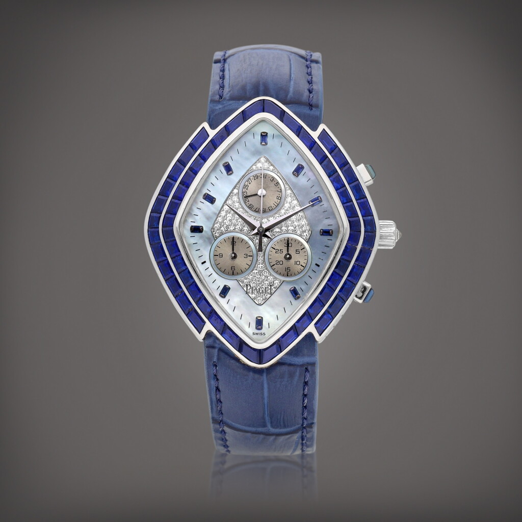 View full screen - View 1 of Lot 2218. Reference 14456 | A unique white gold, diamond and sapphire-set chronograph wristwatch with date and mother-of-pearl dial, Circa 1998 | 伯爵 | 型號14456 | 獨一無二白金鑲鑽石及藍寶石計時腕錶,備日期及珠母貝錶盤,約1998年製.