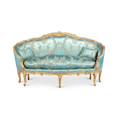 View full screen - View 1 of Lot 183. A Louis XV carved giltwood canapé en gondole, mid-18th century, in the manner of Jean-Baptiste Tilliard.