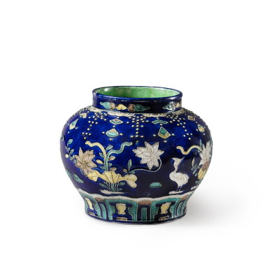 View full screen - View 1 of Lot 157. A Fahua 'lotus' jar Ming dynasty, 16th-17th century | 明十六至十七世紀 琺華荷塘仙鷺紋罐.