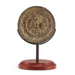 A bronze 'animal and floral' mirror, Tang dynasty 唐 銅瑞獸花卉紋鏡