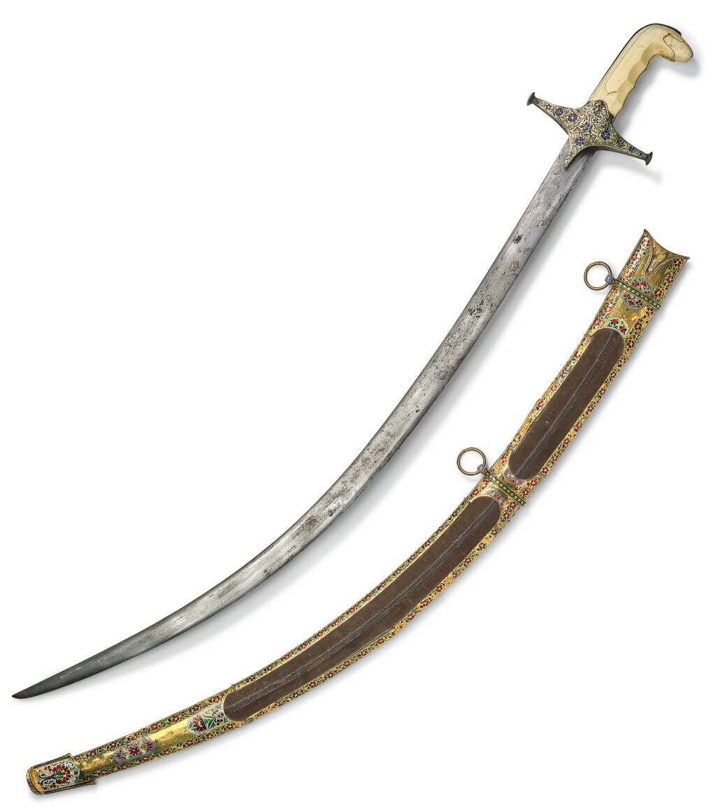 View full screen - View 1 of Lot 499. AN IVORY-HILTED WATERED-STEEL SWORD (SHAMSHIR) WITH ENAMELLED CROSS GUARD AND SCABBARD, PERSIA AND INDIA, PROBABLY LUCKNOW, CIRCA 18TH CENTURY.